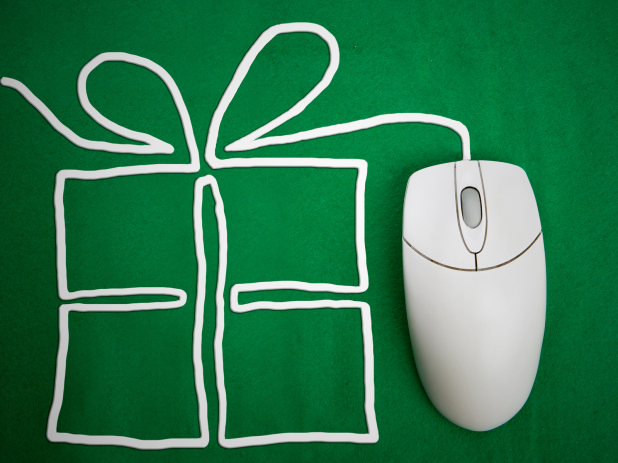 Online present shopping concept mouse on green background with present.