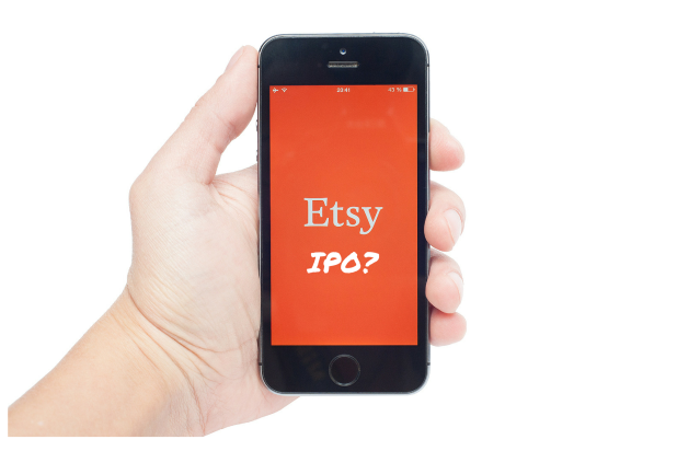 Person holding phone with Etsy IPO question mark