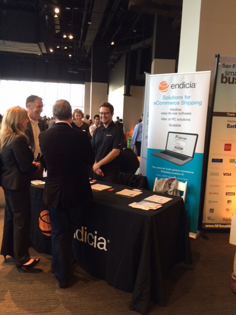 Endicia’s table at the 2015 Small Business Week event in SF- presenting the navigation of shipping costs (FedEx vs. UPS vs. USPS) 