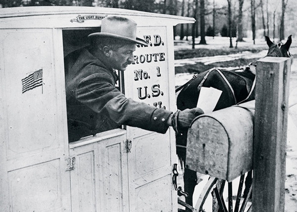 USPS mailman delivering mail – history of the United States Postal Service