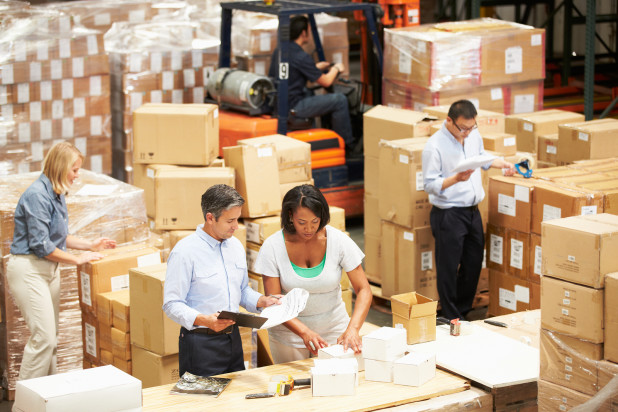People working on warehouse – order management systems –delivering great customer service