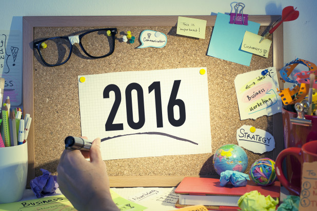 Man writing 2016 New Year’s resolutions ideas for small business growth