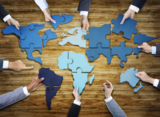 World map broken down into puzzle pieces – international online business expansion tips