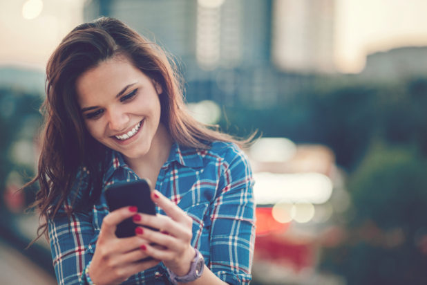 Young woman looking at phone