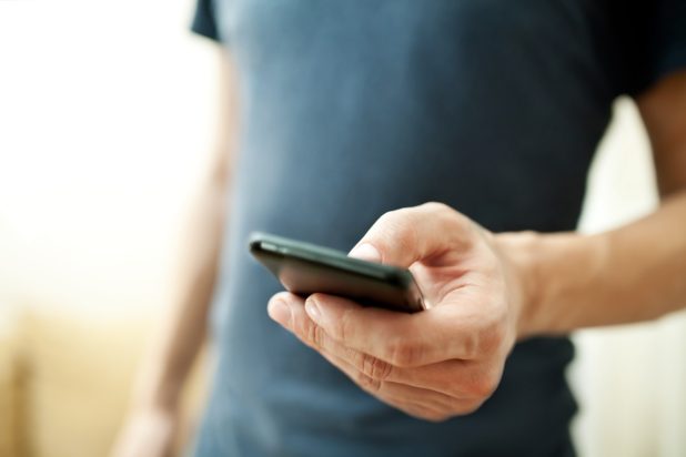 Close up of a man using smartphone