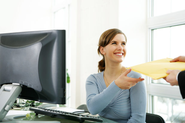 Woman receiving a large envelope